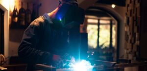 Professional welder working on metal fabrication